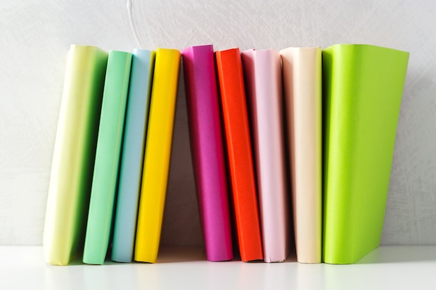  pile of paperback books on a table