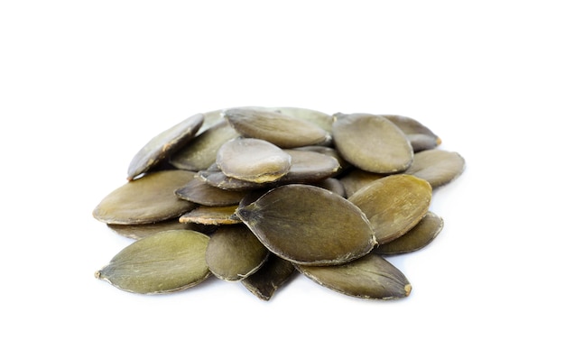 Pile of peeled pumpkin seeds isolated on white