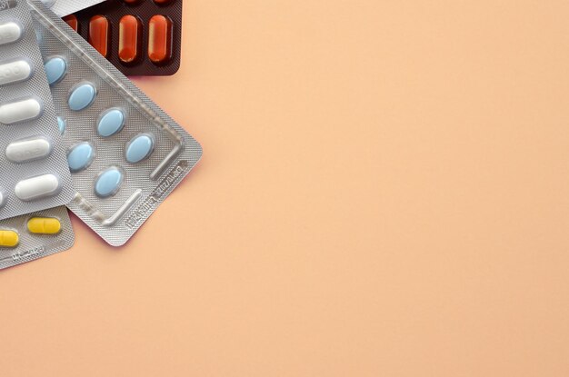 a pile of pills on a light background copy space