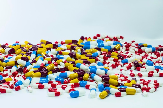 A pile of pills on a white surface