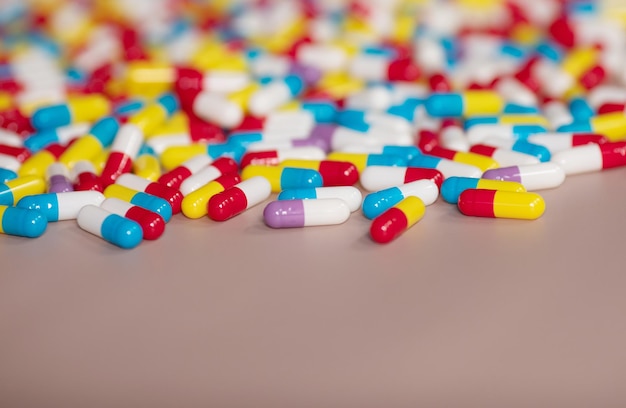 A pile of pills with one of them labeled " capsules ".