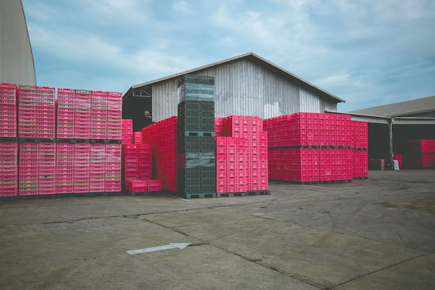 Pile of plastic color pink shipping pallet industrial plastic
pallet stacked at factory warehouse