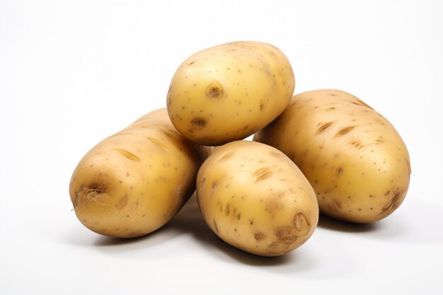 a pile of potatoes sitting on top of a white surface