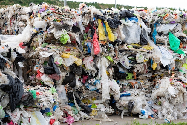 A pile of pressed polyethylene at a garbage collection plant. Sorting and processing of polyethylene. The concept of environmental protection