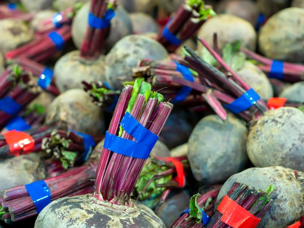 A pile of raw fresh organic beetroots in the supermarket