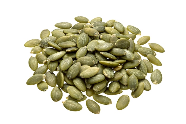 Pile of raw peeled pumpkin seeds isolated on white table