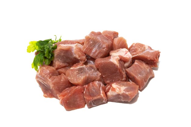 Pile of raw pork meat isolated on white background Very used for stews