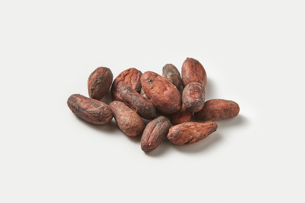 Pile of raw unpeeled cocoa beans