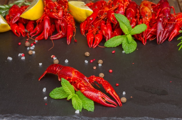 Pile of red boiled Crayfish on black board