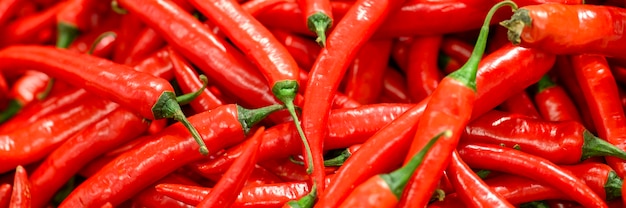 A pile of red hot chili peppers background