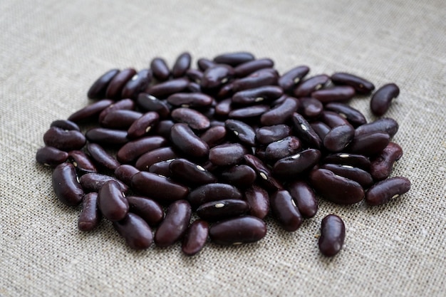 A pile of red kidney beans on a canvas background