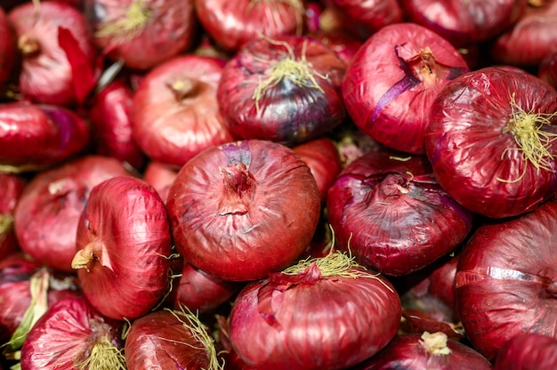 A pile of red onions background