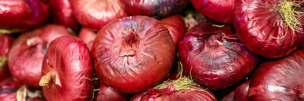 A pile of red onions background