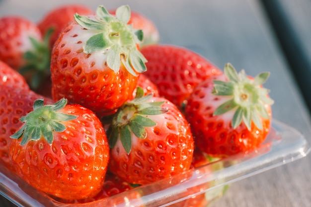 Pile of Red strawberry on wooden table