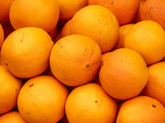 Pile of ripe oranges top view