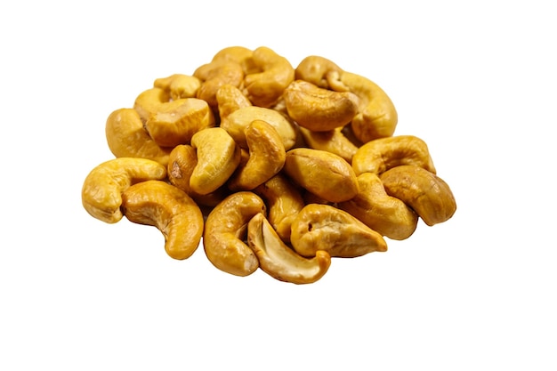 Photo pile of roasted cashew nuts isolated on white background