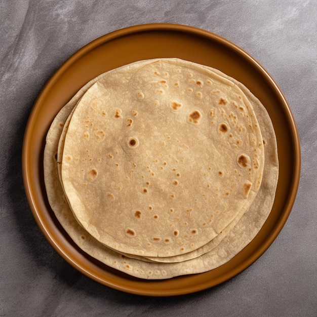A pile of roti chapati isolated on wooden basket and wooden background