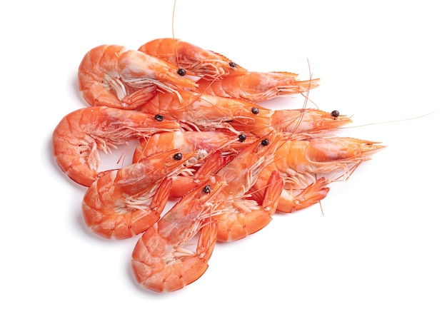 Pile of shrimps cut out on a white surface