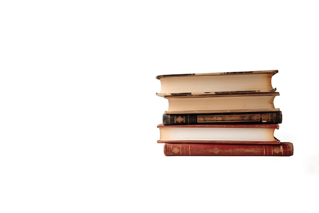 Pile of some old books isolated on white background with copy space