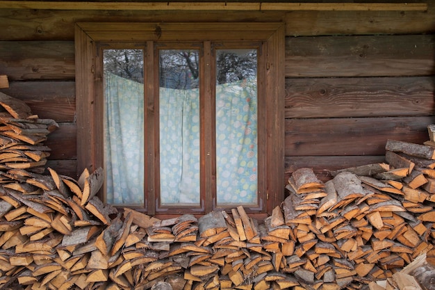 Pile of stacked firewood, prepared for heating the house.Ecological concept.