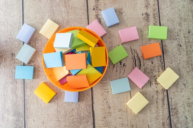 Photo pile of sticky notes on office table at work