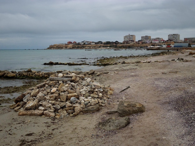 A pile of stones on the shore of the Caspian Sea Aktau city Kazakhstan Mangistau region 12 October 2019 year