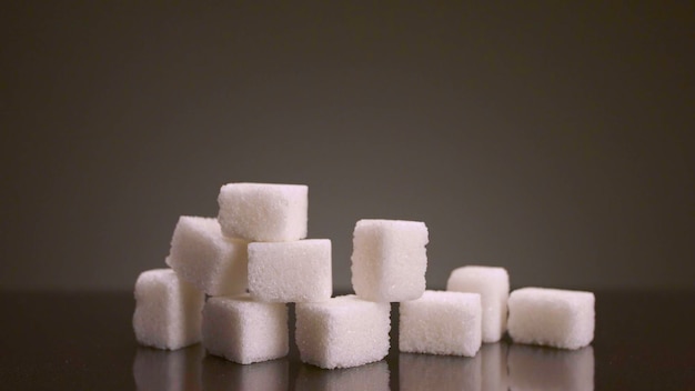 Photo pile of sugar cubes on isolated background stock footage pile of sugar cubes changes in number on