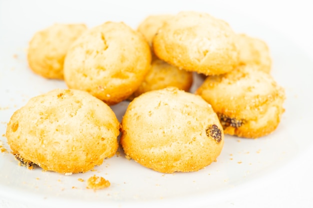 A pile of sweet biscuits with raisins