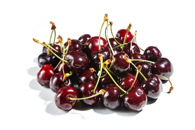 Pile of sweet cherry isolated on white background.