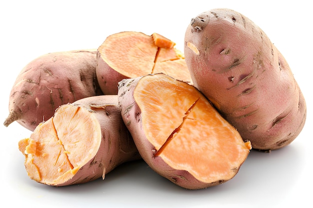 Photo a pile of sweet potatoes on a white surface