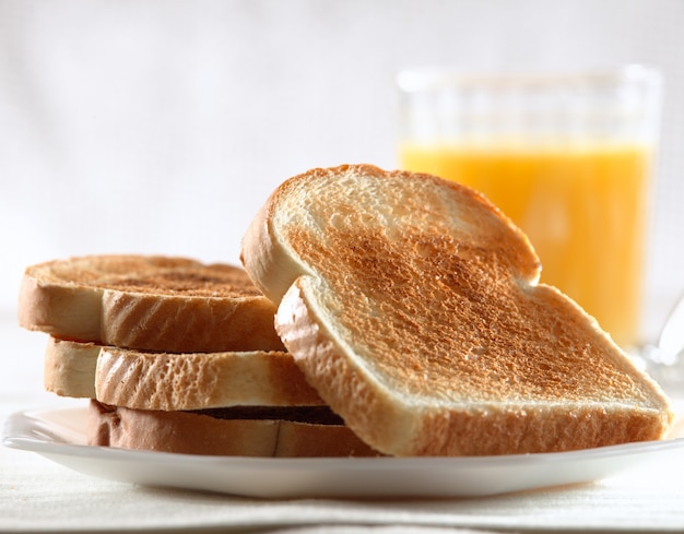 Photo pile of toast for breakfast on plate