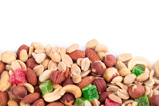 Pile of toasted nuts and candied fruit isolated