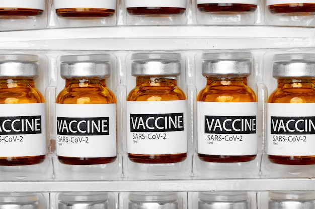 Pile of vials of Sars-cov-2 vaccine close up photo