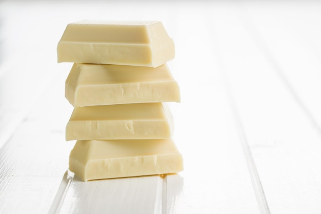 Pile of white chocolate on white table