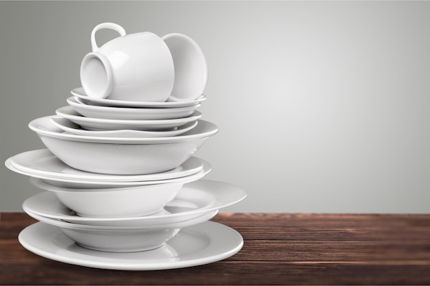 Pile of White Dishware on desk