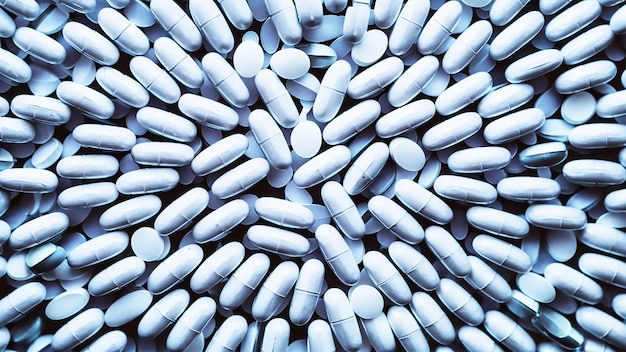 a pile of white pills that are on a table