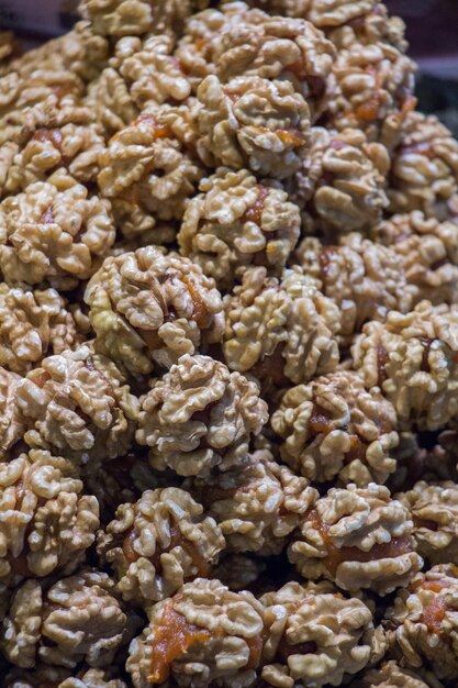 Pile of whole fresh walnuts without nutshells