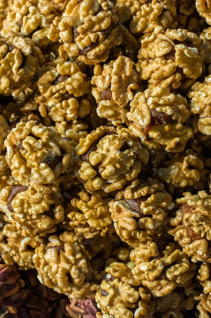 Pile of whole shellde walnuts in view