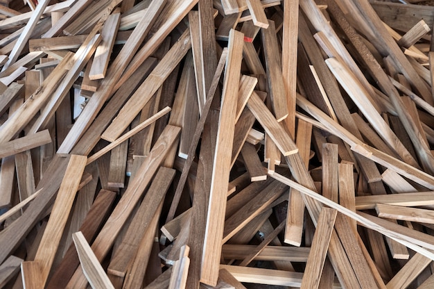 Pile of wood logs for build Furniture production,sew natural wood scraps, ready to recycle and reuse process in improved waste management under efficient sustainable approach to save environment