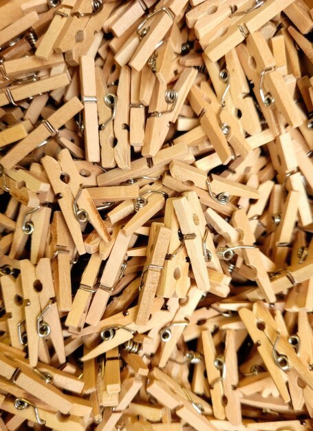 A pile of wooden pegs with a bunch of screws on them