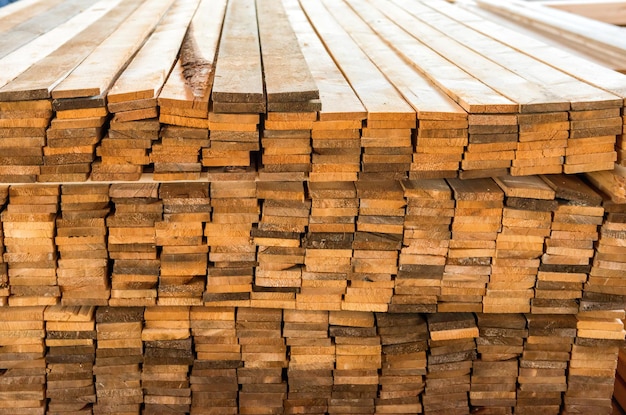 Pile of wooden planks in the timber factory