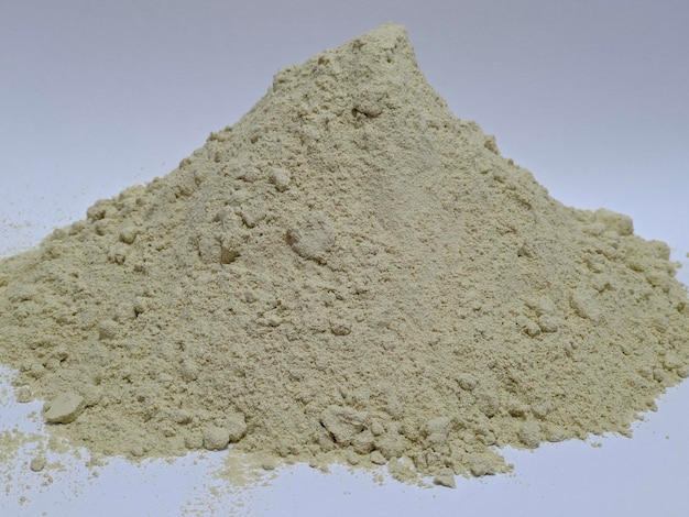 A pile of yellow powder on isolated background