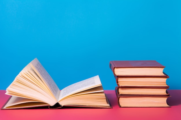 Piles of books on a blue background