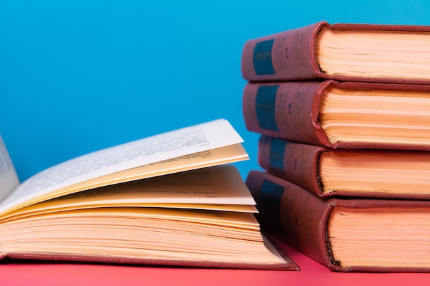 Piles of books on a blue background