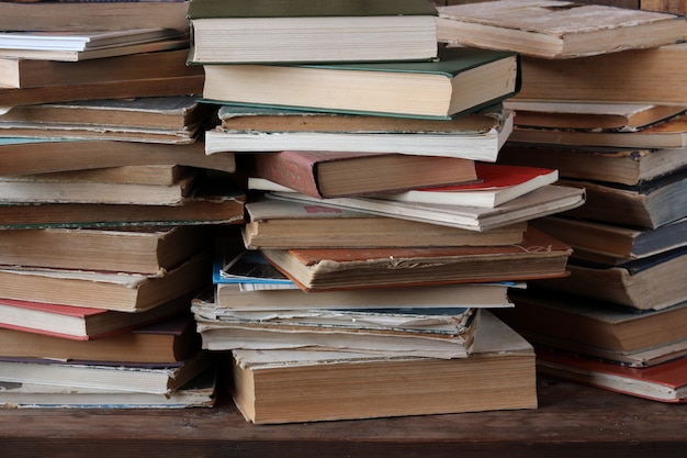 The piles of books on the table. 