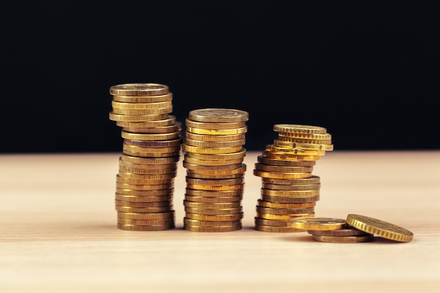 Piles of coins on working table