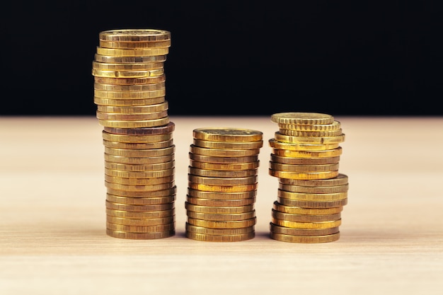 Piles of coins on working table