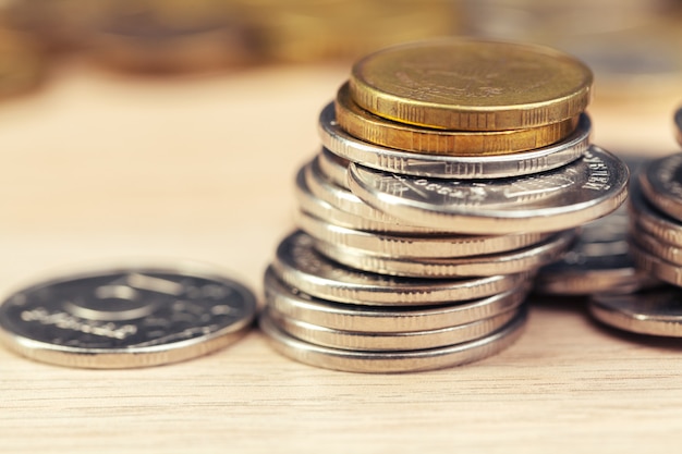 piles of coins on working table