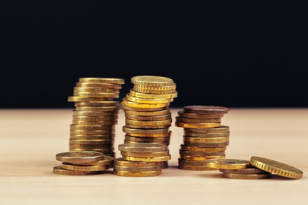 piles of coins on working table