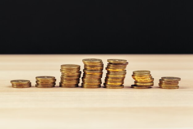 Piles of coins on working table